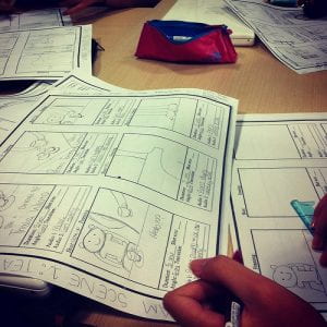 A person drawing out a storyboard