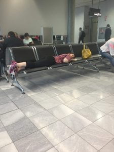 Rachael sleeping in the airport.