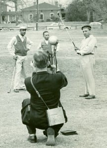 Reporter photographing Alfred Holmes, Charles Bell, and Oliver W. Holmes at North Fulton Golf Course, December 24, 1955