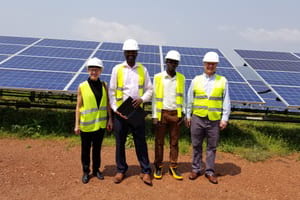 A visit to the GigaWatt Solar power plant in Rwanda. Valerie Thomas, Paul Rugambwa, GigaWatt Solar engineer, and Jonathan Colton. 